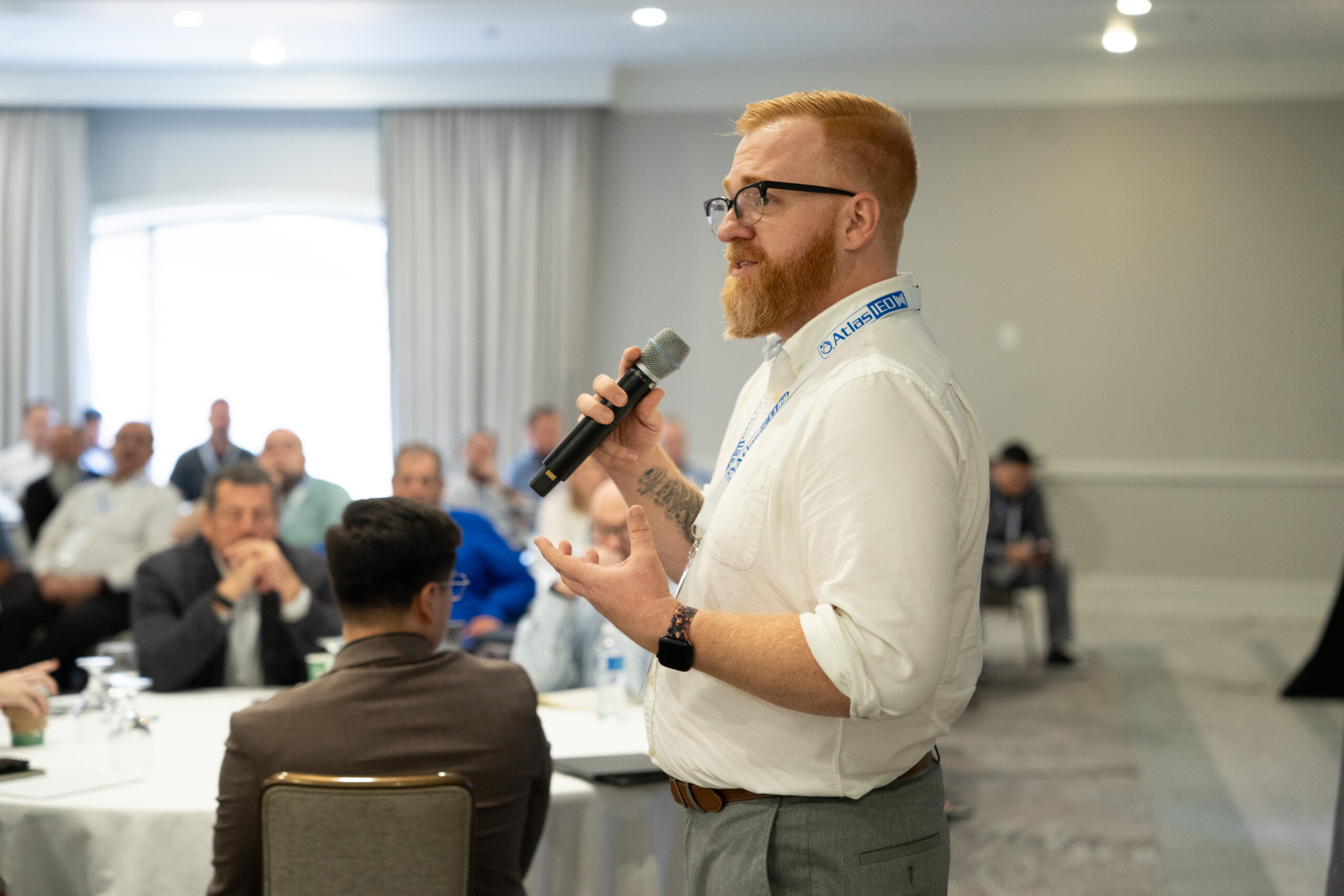 man standing with microphone