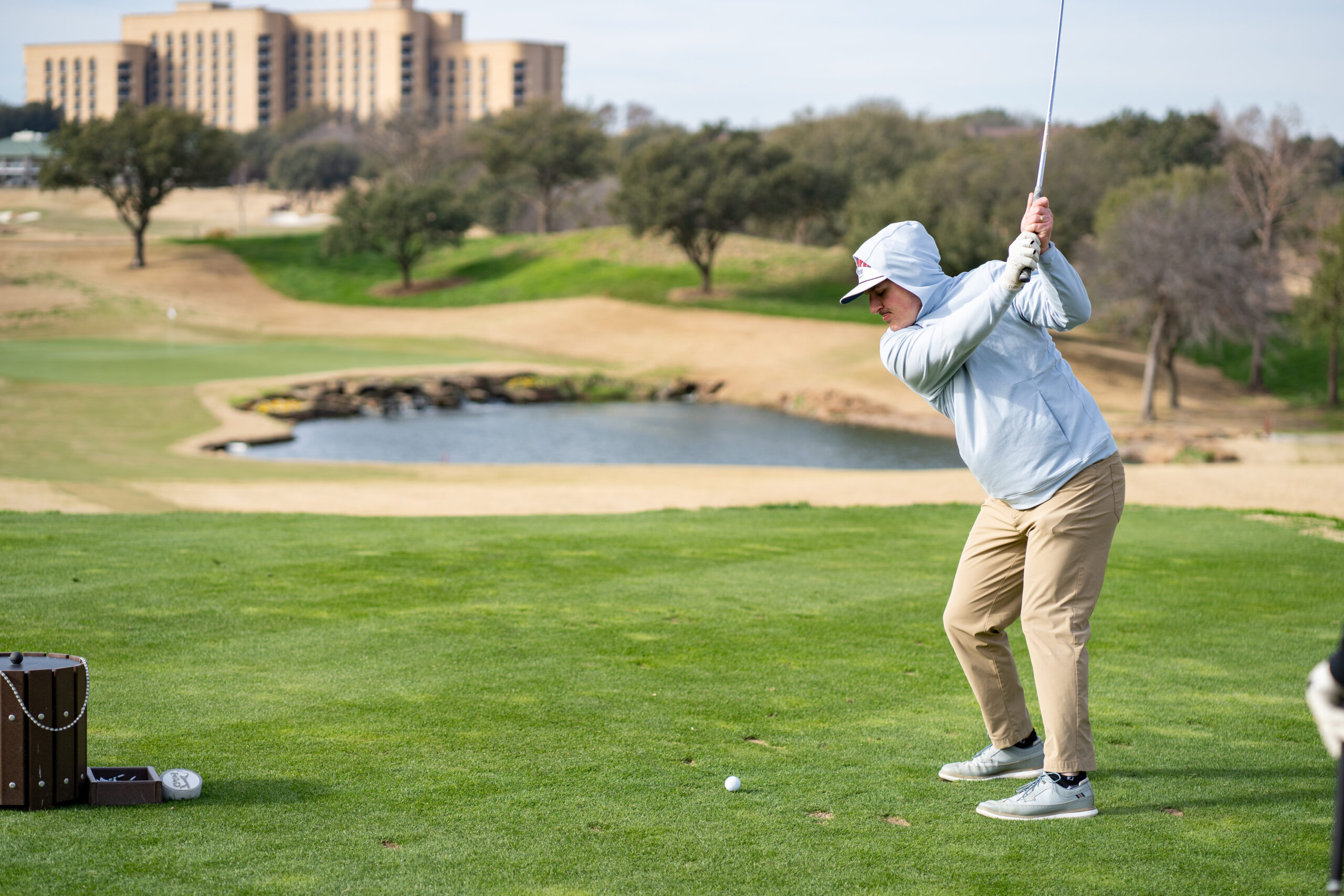 Man Swinging Club